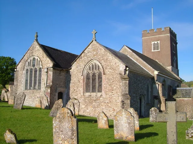 St Michael's parish church, Gittisham, Devon, seen from the northeast, showing the chancel (centre), south chapel (left) and west tower (right)