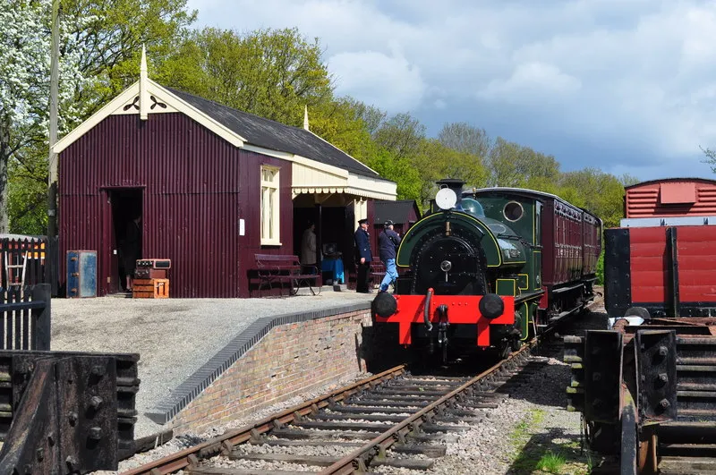Brockford Station at the MSLR Museum, near to Wetheringsett, Suffolk, Great Britain. A view from the crossing gates of Brockford station, a recreation of a typical MSLR station. Built using conponents from stations on the line. It used the old cattle dock at the station. Falmouth Docks number 3 hauls MSLR liveried GER coaches up and down the line.