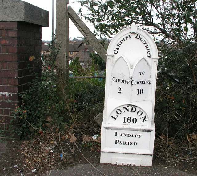 Mile Marker on Cowbridge Road West I have found 7 of these old cast iron mile markers between Bridgend and the centre of Cardiff. This one is near Ely Roundabout at the railway bridge. All have been uploaded. Does anyone know their history?