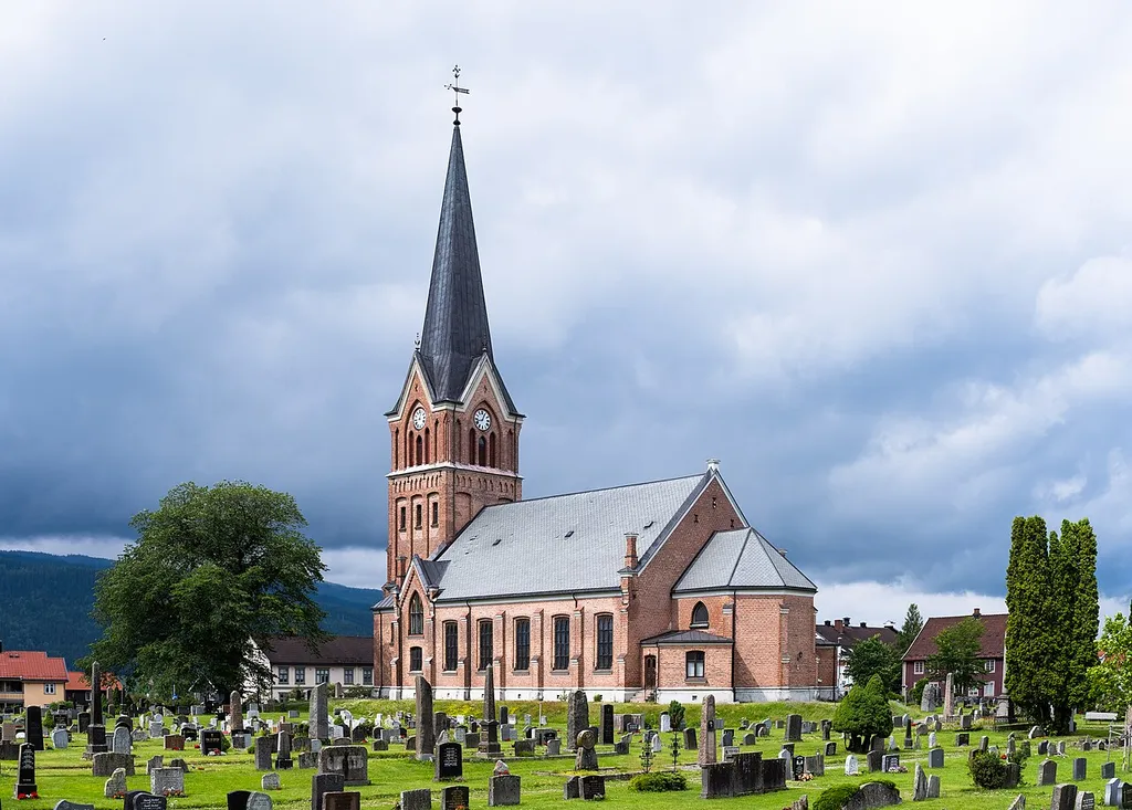 The Lillehammer Church (Lillehammer kirke), a neo-Gothic brick church built in 1882, photographed from the cemetery. The church is located in the center of Lillehammer, Innlandet, Norway.
