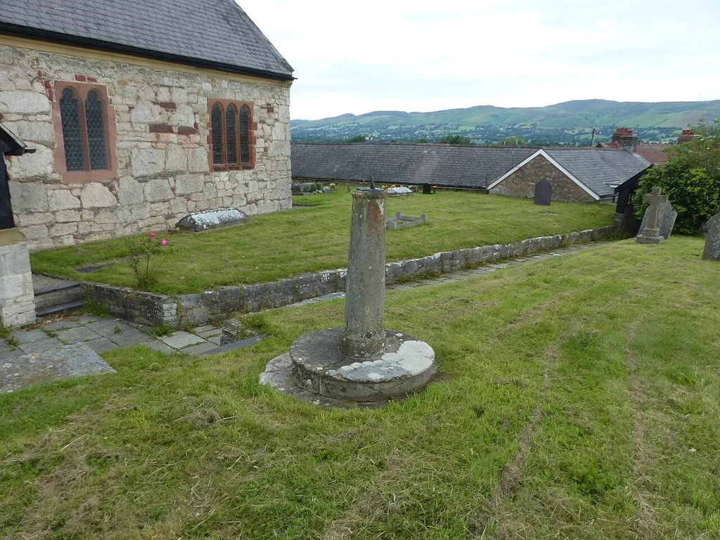 Grade II listed building in Llanfwrog, Denbighshire. Listed as "Sundial S of porch, Church of St Mwrog". .mw-parser-output .messagebox{margin:4px 0;width:auto;border-collapse:collapse;border:2px solid var(--border-color-progressive,#6485d1);background-color:var(--background-color-neutral-subtle,#fbfcff);color:var(--color-base,#202122);box-sizing:border-box;border-inline-start-width:8px}.mw-parser-output .messagebox.mbox-small{font-size:88%;line-height:1.25em}.mw-parser-output .mbox-warning,.mw-parser-output .mbox-speedy{border:2px solid var(--border-color-error,#b22222);background:var(--background-color-error-subtle,#ffdbdb);border-inline-start-width:8px}.mw-parser-output .mbox-serious,.mw-parser-output .mbox-delete,.mw-parser-output .mbox-stop{border:2px solid var(--border-color-error,#b22222);border-inline-start-width:8px}.mw-parser-output .mbox-issue,.mw-parser-output .mbox-content{border:2px solid #f28500;background:var(--background-color-warning-subtle,#ffe);border-inline-start-width:8px}.mw-parser-output .mbox-query,.mw-parser-output .mbox-style{border:2px solid #f4c430;background:var(--background-color-warning-subtle,#ffe);border-inline-start-width:8px}.mw-parser-output .mbox-shit{border:2px solid #960;border-inline-start-width:8px}.mw-parser-output .mbox-license{border:2px solid #88a;border-inline-start-width:initial}.mw-parser-output .mbox-legal{border:2px solid var(--border-color-notice,#666);background:var(--background-color-base,#fff);border-inline-start-width:8px}.mw-parser-output .mbox-honor{border:2px solid #ca3;background:var(--background-color-warning-subtle,#fcf4db);border-inline-start-width:8px}.mw-parser-output .mbox-growth{border:2px solid #8d4;background:var(--background-color-success-subtle,#d5fdf4);border-inline-start-width:8px}.mw-parser-output .mbox-move{border:2px solid #93c;border-inline-start-width:8px}.mw-parser-output .mbox-protection,.mw-parser-output .mbox-message{border:2px solid var(--border-color-base,#aaa);border-inline-start-wid