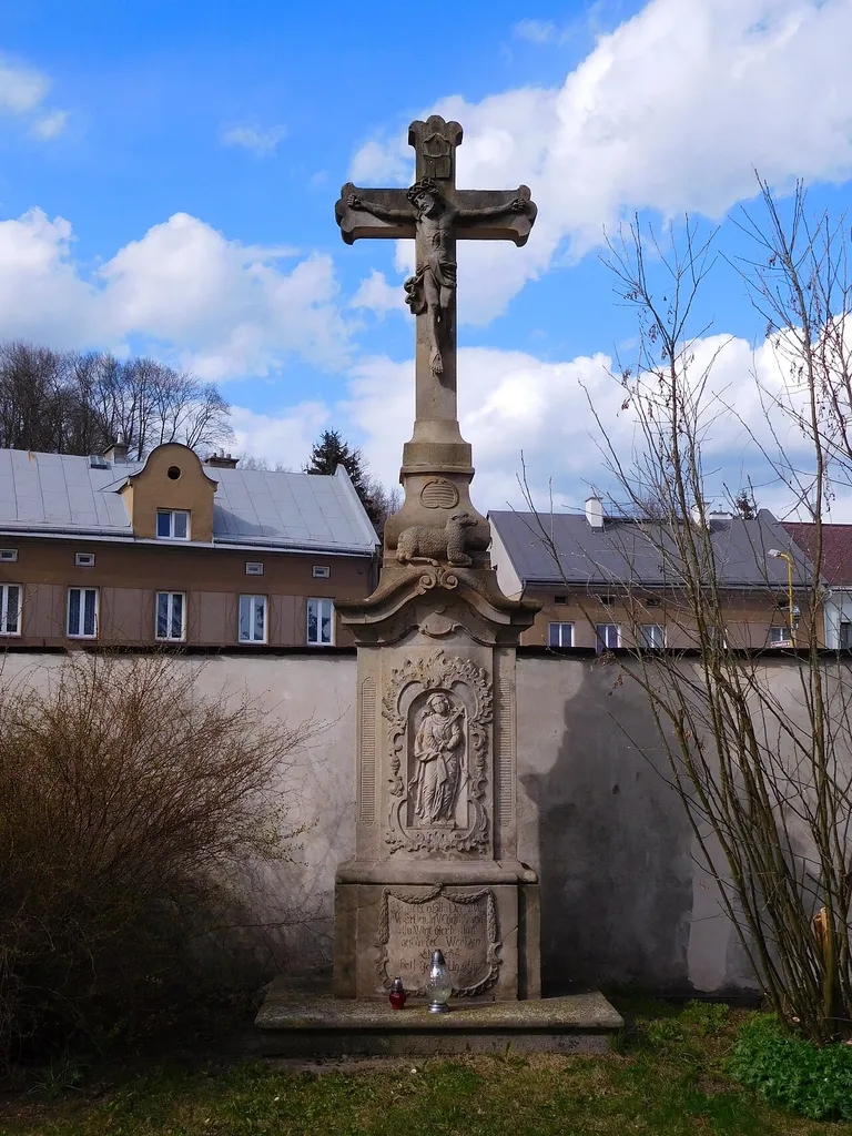 1809 stone cross at the Holy Trinity Church in Hostinné
