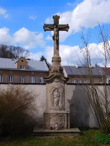 stone cross at the Holy Trinity Church in Hostinné