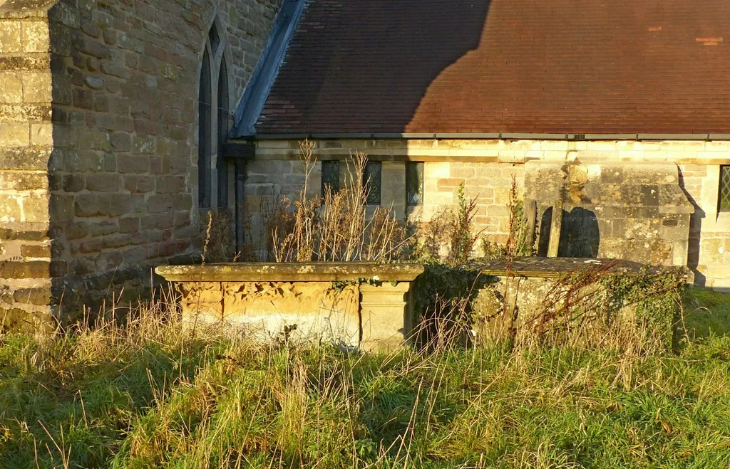Photograph of two chest tombs in the churchyard of St Swithin's Church, Wellow, Nottinghamshire, England