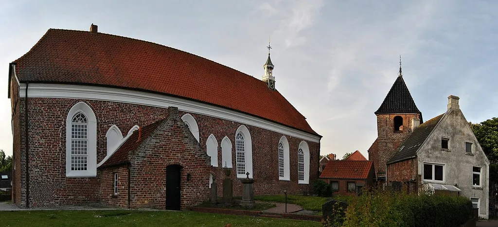 Panorama view from the southwest on the church of Greetsiel, Krummhörn, East Frisia, Germany.