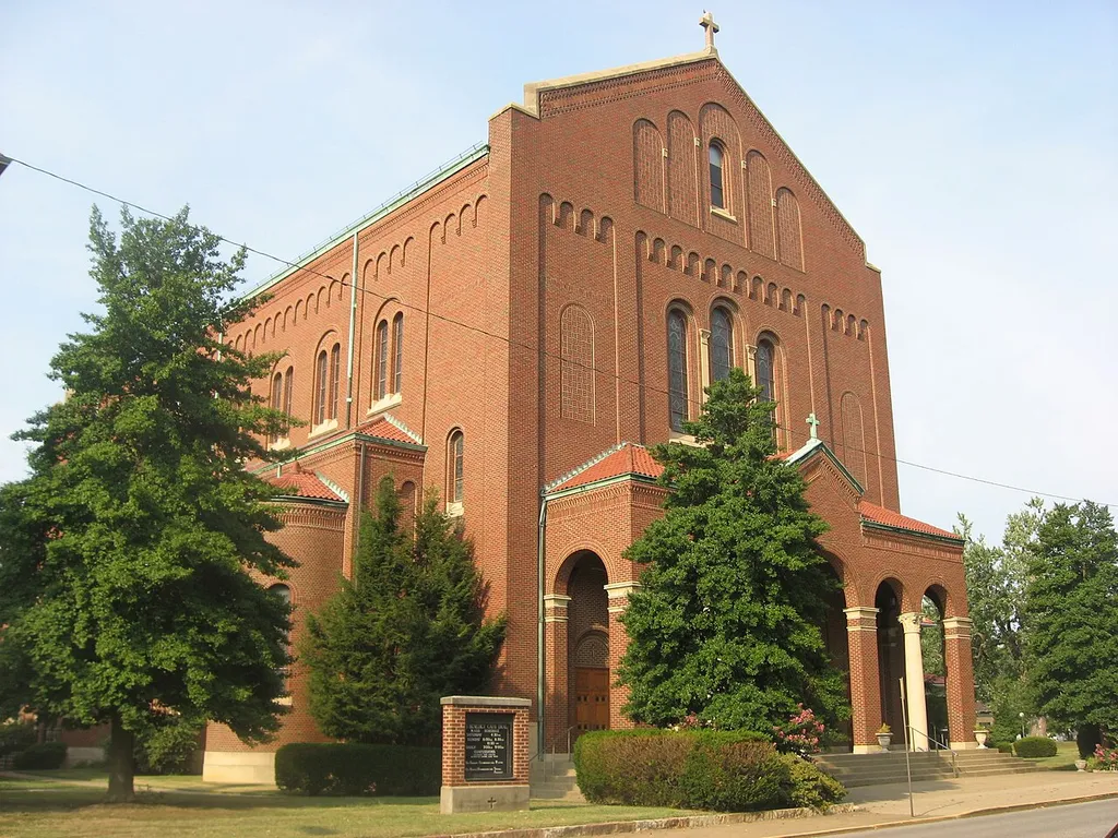 Front and western side of the Cathedral of St. Benedict, located at 1320 Lincoln Avenue in Evansville, Indiana, United States. Completed in 1928, it is the cathedral for the Roman Catholic Diocese of Evansville. It is also a leading part of the Lincolnshire Historic District, a historic district that is listed on the National Register of Historic Places.