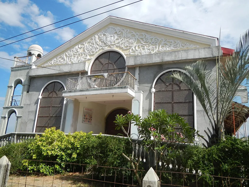 Holy Trinity Parish Church (New Cabalan, Olongapo City) of the Roman Catholic Diocese of Iba in Barangay New Cabalan beside Old Cabalan, Olongapo City (along Gapan-San Fernando-Olongapo (G.S.O.) Road Km 117+750 (Km 118+-250) Highway Boundary all at the foot of Mount Samat and surrounded by the Roosevelt Protected Landscape at the foot of Mount Santa Rita and Mount Malasimbo in the Zambales Mountain Range at the border between the municipalities of Dinalupihan and Hermosa in Bataan, from and along the Bataan Provincial Expressway also known as the Roman Expressway or the Roman Superhighway, interconnecting with and to Olongapo-Gapan Road).