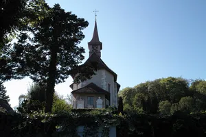 St. Niklaus catholic church with surrounding grave monuments