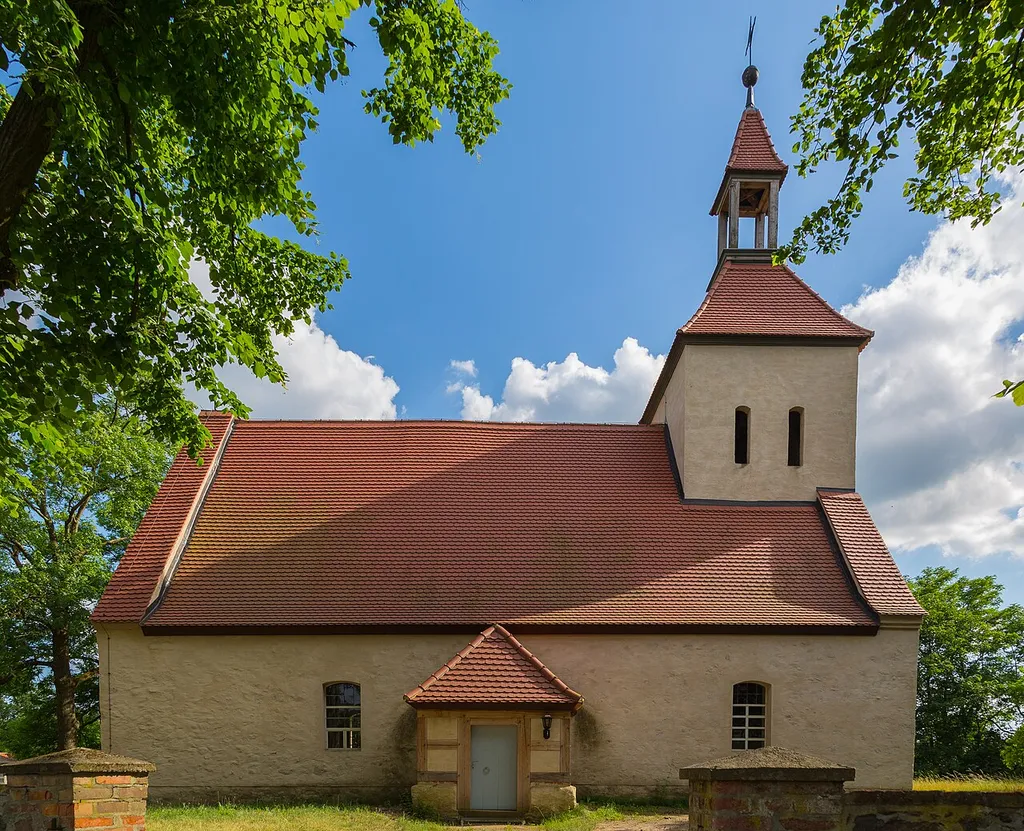 Listed Protestant Village Church (Dorfkirche) in Mittweide, part of the municipality Tauche, Landkreis Oder-Spree, Brandenburg, Germany. The plastered fieldstone church is dated to 1401/1450. The steeple was erected after 1830. The aisleless church has remains of a frescoed mural, also dated to 1401/1450, which shows the Last Judgment.