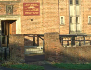 Boundary wall and gates to Church of St James and St Christopher
