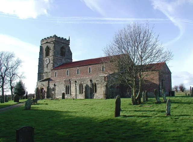 Church of St John the Baptist, Carnaby, East Riding of Yorkshire, England.The church at Carnaby was first mentioned in a grant to the Priory (1148-53) although only the font remains from the original Norman church. The oldest parts of the building are from the 13th century and most of the tower from the 15th century. Much of the church was rebuilt in brick between 1680 and 1719.