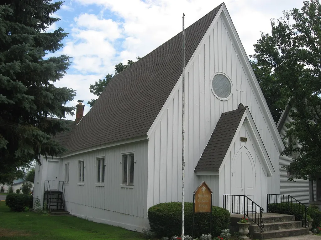 Front and eastern side of the former St. Paul's Episcopal Church, located along W. High Street (State Routes 2 and 49) in Hicksville, Ohio, United States. Built in 1873, it is listed on the National Register of Historic Places.