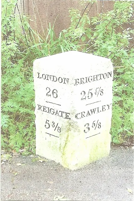 Milestone, Povey Cross Road, Gatwick Airport, by "Greenvale" on emergency exit road