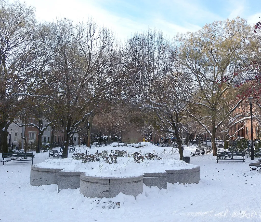 Looking west into Cobble Hill, Brooklyn Park on a sunny afternoon after snowfall.