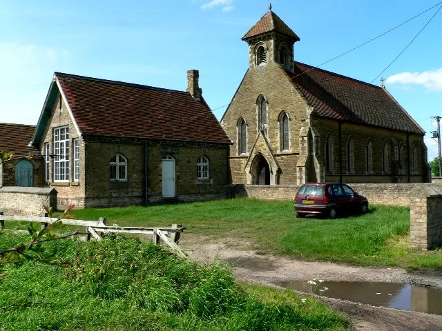 St John's parish church (right) and former school (left), North Cliffe, East Riding of Yorkshire, England, seen from the southeast.