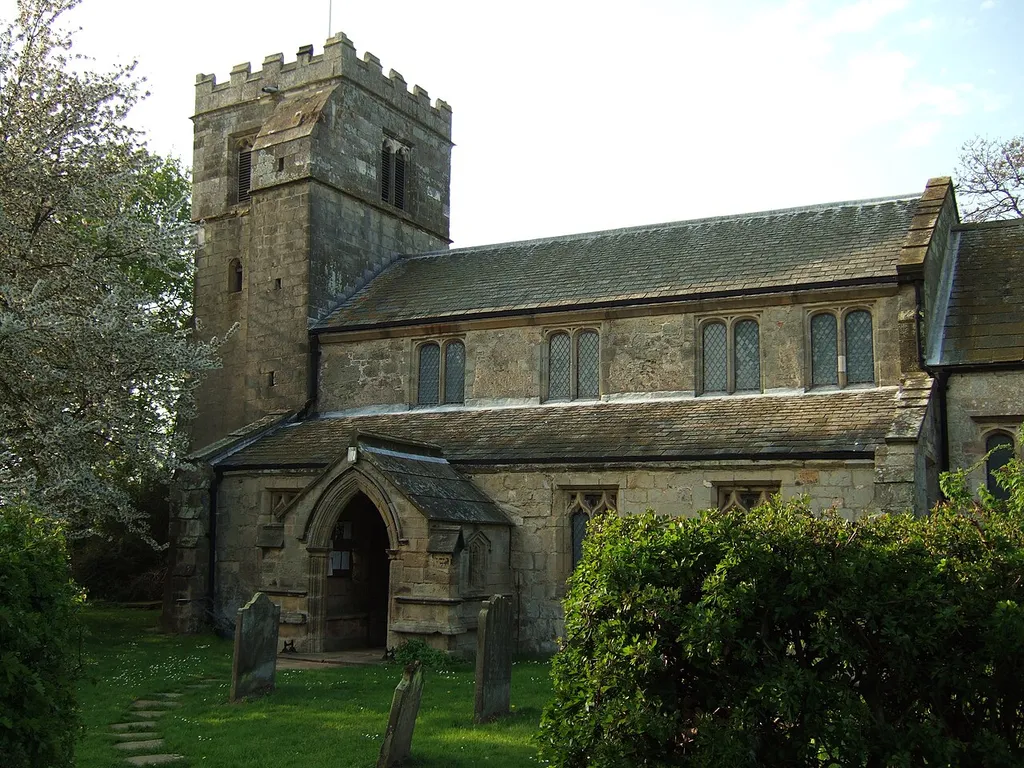 Nave and west tower of the parish church of St Michael and All Angels, Sutton upon Derwent, East Riding of Yorkshire, England, seen from the southeast.