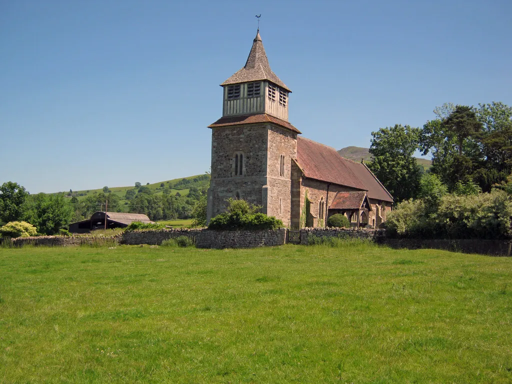St Mary's parish church, Bitterley, Shropshire, seen from the west. The summit of Titterstone Clee Hill is can be seen above the chancel roof.