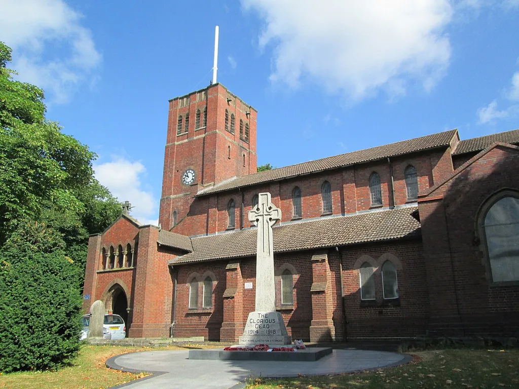 St Giles' Church, in Rowley Regis, Sandwell, West Midlands. In front of the church is a Grade II listed war memorial.