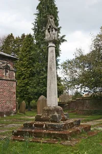 Cross base and cross in churchyard of Church of St Lawrence