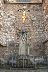 Crucifix in front of north facade of the Cathedral of Saints Peter and Paul in Brno