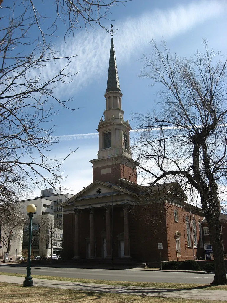 The First Baptist Church of Denver, located at the intersection of Grant Street and Fourteenth Avenue in Denver, Colorado, United States. Built in 1938, it is listed on the National Register of Historic Places. Picture is taken from the grounds of the Colorado State Capitol, located across the street from the church.