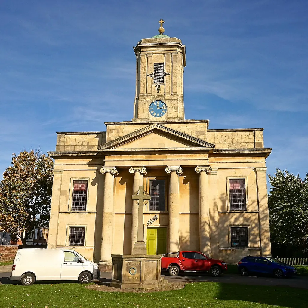 St Paul's parish church, St Paul's Road, Cheltenham, Gloucestershire, seen from south-southwest, with the parish war memorial in front