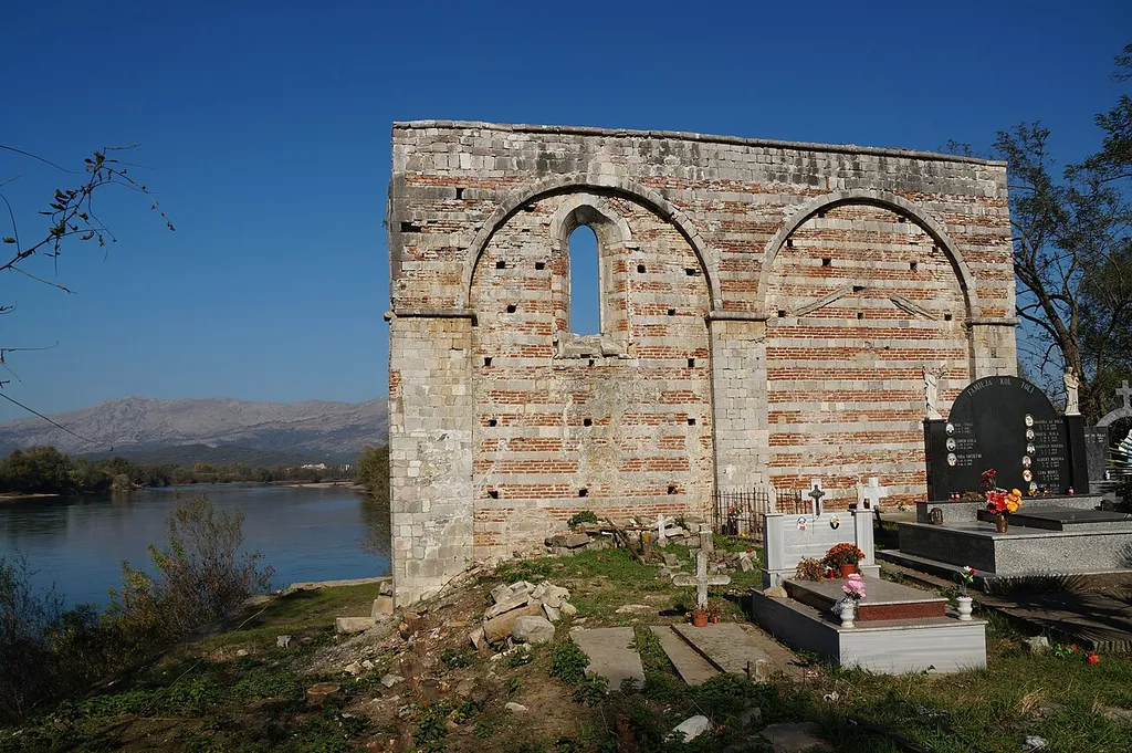 Ruins of the Church of Shirgj: the remaining wall and parts of the cemetery