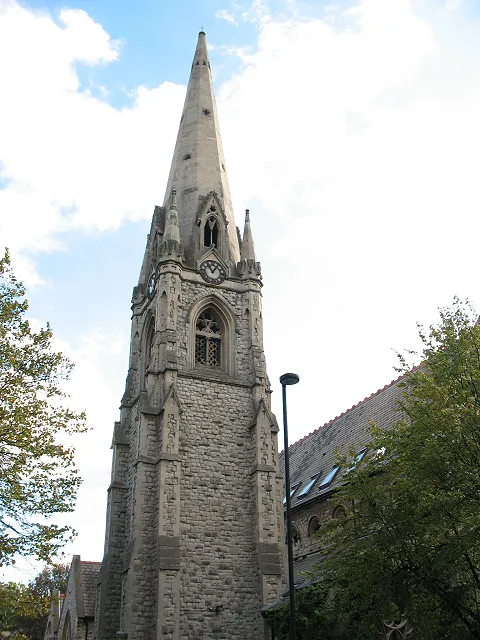 North tower and spire of Black Roof House, 97b Knatchbull Road, London SE5. The building was completed in 1870 as the parish church of St James the Apostle. The Church of England Diocese of Southwark declared it redundant in 1981. In 1982 it was leased and converted into co-operative housing.