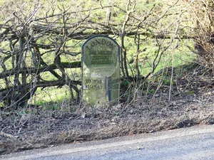 Mile post, north of old railway bridge at NGR 173 512