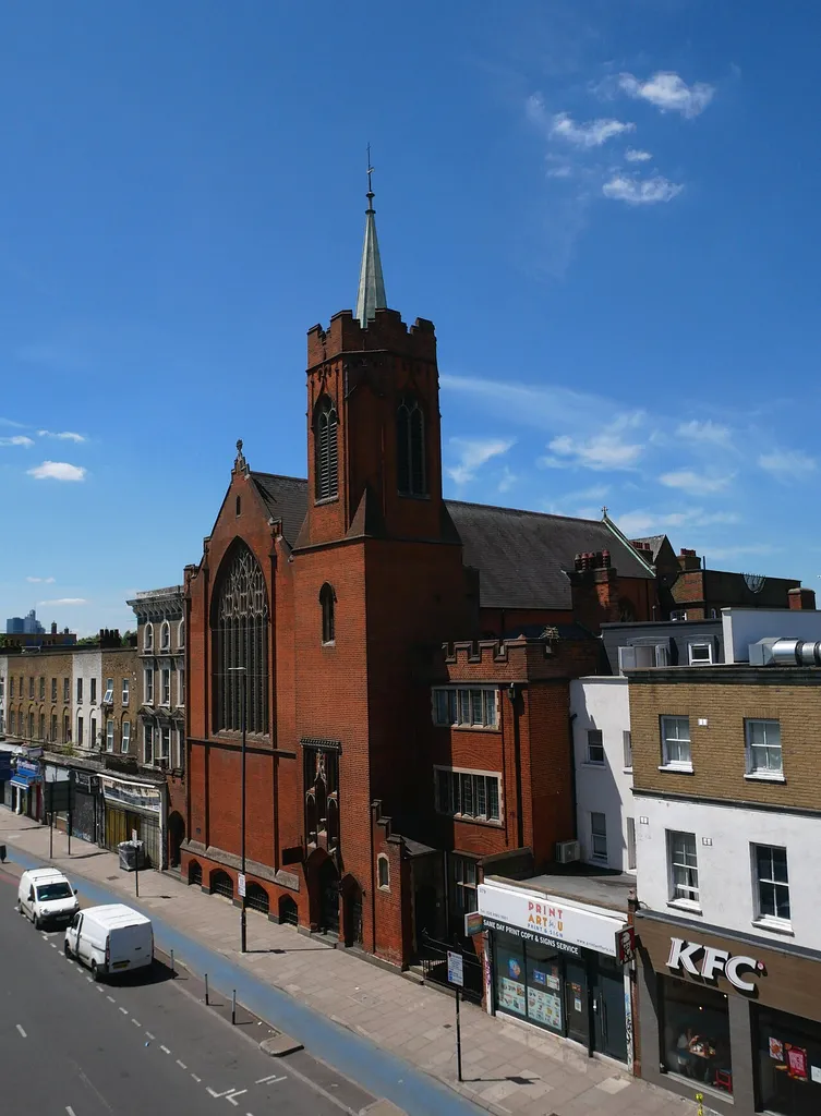 A view of the Guardian Angels Roman Catholic Church, Mile End as seen from the southeast, elevated in Mile End Park.