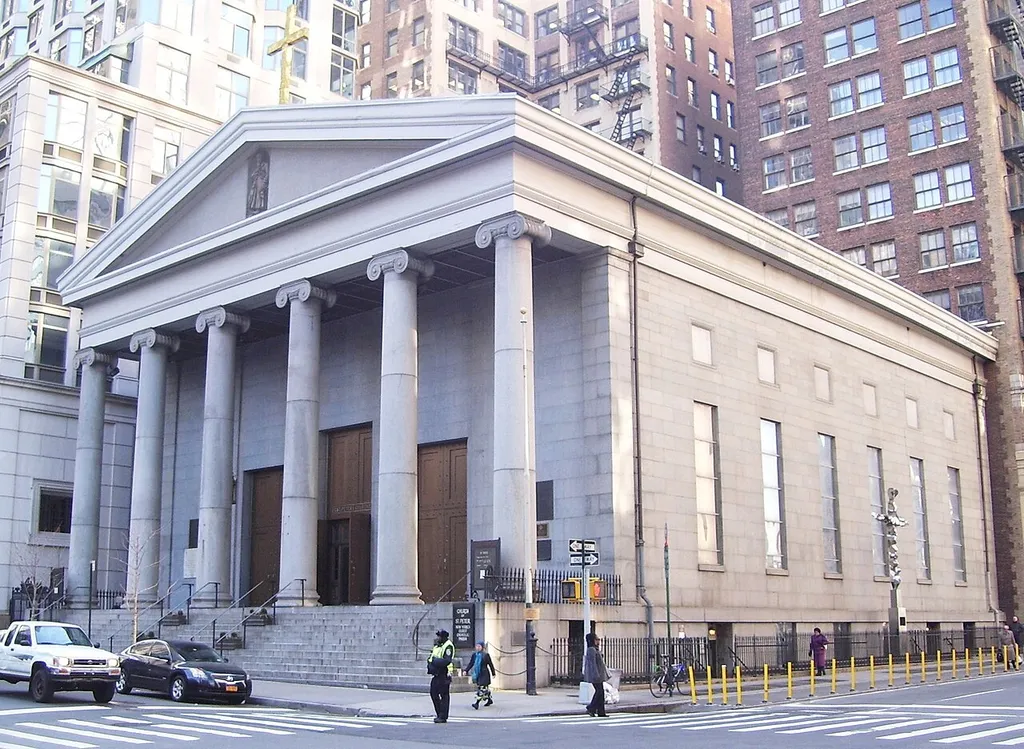 St. Peter's Roman Catholic Church at 22 Barclay Street at the corner of Church Street in the Financial District of Manhattan, New York City was built in 1836-40 and was designed by John R. Haggerty and Thomas Thomas in the Greek Revival style, with 6 Ionic colums. The parish is the oldest Roman Catholic parish in the city, and the building replaced an earlier one built in 1785. It was designated a NYC landmark in 1965. (Source: Guide to NYC Landmarks (4th ed.))