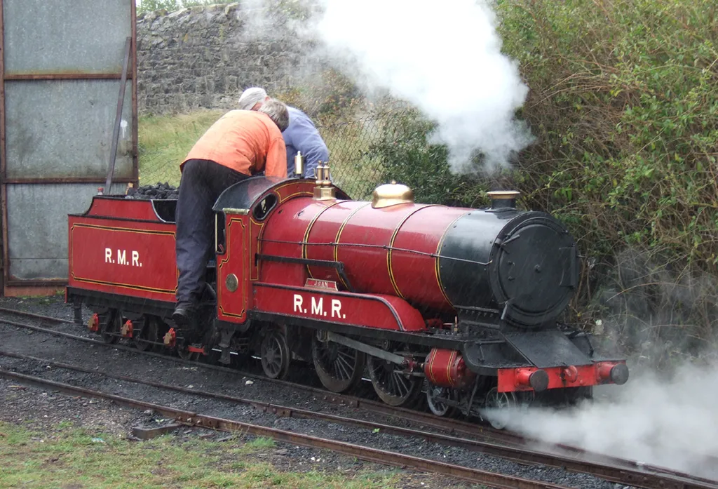 Rhyl Miniature Railway. Resident Engine 'Joan' at the Engine Shed (in the rain). 13th August 2005 Photographer - A.M.Hurrell Camera - Fuji FinePix F10 Modified - Trimmed and file size reduced using Finepix Software
