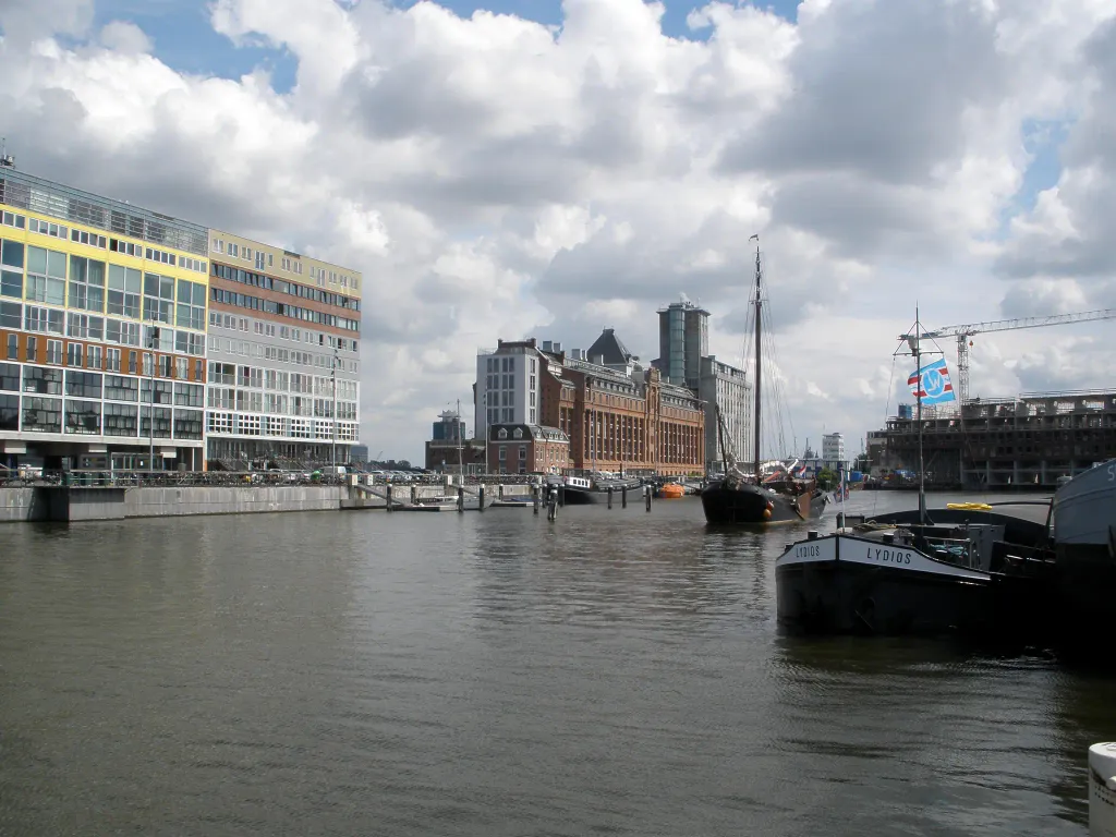The Oude Houthaven, a harbour in Amsterdam. On the left, the 2002 building on the Silodam designed by agency MVRDV. Beyond that, two former grain silos converted into apartment buildings. On the right, a new building under construction.