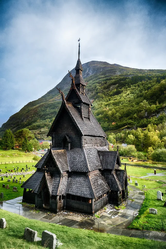 Borgund Stave church, about 800 years old and made entirely of wood. It's located near Lærdal and to get it you have to pass through the world's longest road-tunnel.It looks deceptively large, it's actually quite small and the entrance only fits one person.The construction is resilient thanks to the wood treatment: A tall tree would be found, its branches cut and the tree would start emitting sap. The sap covered the tree and they'd leave the tree alone for 5-20 years. That wood which had then 'self preserved' was used in this kind of construction. The base of the church sits on stone, so no ground moisture seeps upwards and the climate is generally pretty favorable with low humidity. So with these factors the church hasn't rotted away.There used to be hundreds of these across Norway but now only 20-30 remain.