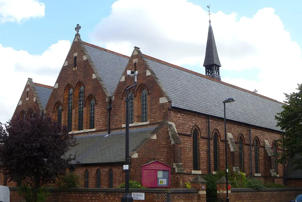 St Thomas's Church, Islington, 1889-89 by Ewan Christian, showing the west front and south aisle with lancet windows. Narthex set below the west windows and a fleche rises from the roof.