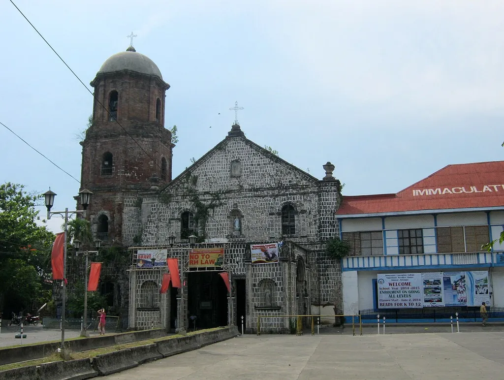 Facade of Balayan Church seen from the church patio