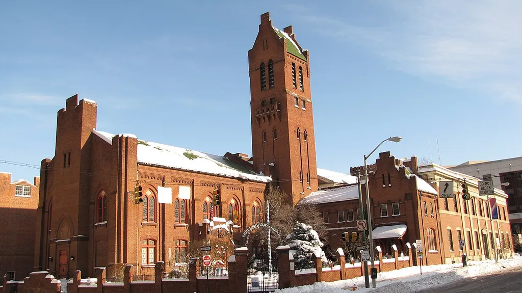 View from City Hall of 400 block of E. Lexington St.: Zion Church of the City of Baltimore and old Fire Department Headquarters in the snow