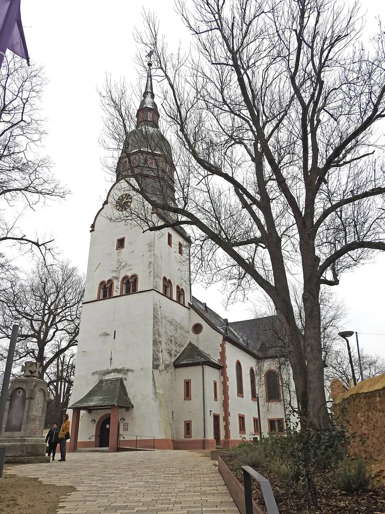The church dates back to the 12th century and was previously the Catholic Church of St. Martin. The core of the choir tower is Romanesque, the bell storey was added in 1563. The domed helmet, the east portal and the porch were added in 1895/96. The nave was rebuilt in Baroque style in 1782-1787 and extended in 1895/96. In the tower hall there are tombs from the 16th and 18th centuries.