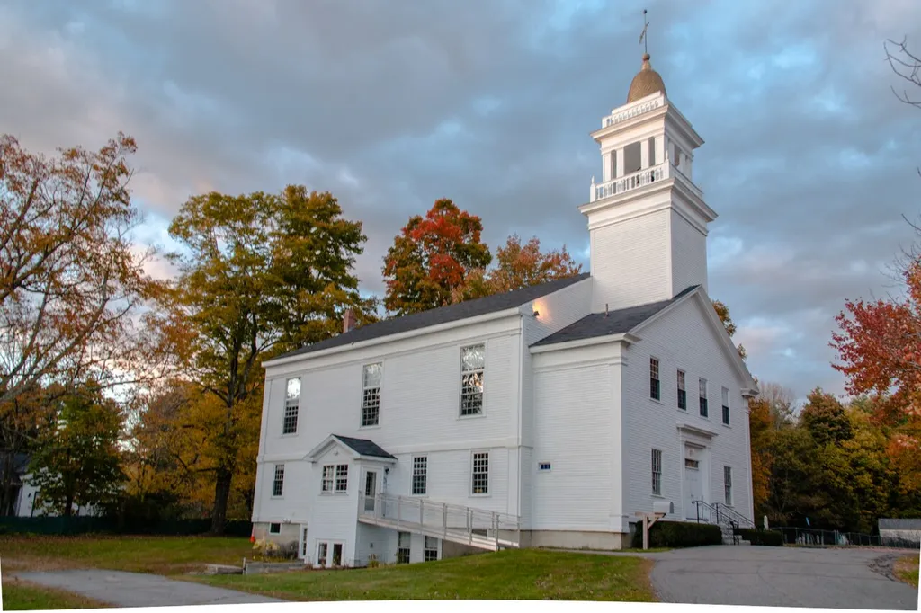 Located in Pownal, Maine. The First Parish Congregational Church of Pownal, completed in 1811, sits at the foot of Bradbury Mt. at the crossroads of Hallowell Road (Route 9) and Elmwood Road. The Reverend Perez Chapin was its first pastor. This church was built by a crew headed by master carpenter Uriel Whitney, a Revolutionary War veteran who moved to West Pownal Road in North Yarmouth after the war and built a new house. The house still stands. He also taught school in Pownal. He was active in this church and is buried in the cemetery to the right of the church. (Panoramio.com)