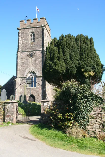 Molland: St Marys church. The west tower. The church dates from the 15th and 16th centuries. Evidence of the earlier church comes in the form of a Norman font and two medieval bells. St Marys was not subjected to Victorian restoration and retains its 18th century box pews and pulpit
