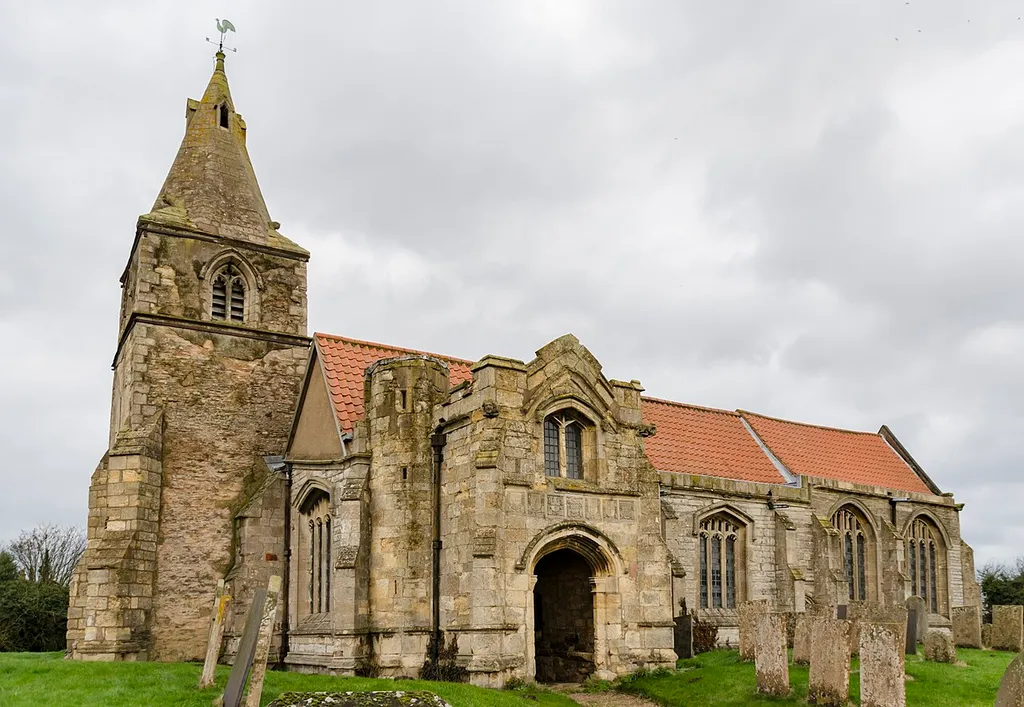 Early English and Decorated with Perpendicular tower arch. Re-used C12 and C13 material from original parish church which was demolished and rebuilt in 1862 by Edward Browning. Contains a monument to John Barton (d.1491) a rich wool merchant who founded the church. He built the tomb in his lifetime featuring him and his wife Isabella, with a cadaver "memento mori" below. 'Miseremeni mei saltem vos amici mei quia manus domini tetigit me' ('Pity me you at least my friends for the hand of the Lord has touched me'). The room over the porch is at the centre of the local legend of ‘Nan Scott’s Chamber’. It is said that Nan Scott left her house in Holme during the great plague of 1666 to live in this room away from infection for several weeks. When forced to visit her house for supplies she found the parish deserted except for herself and one other, and was so horrified she returned to the chamber and ended her days there.