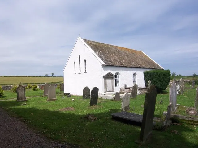 Lisbane Roman Catholic Church "This is on the west side of the main road from Newtownards to Portaferry, two miles south of Kircubbin It is in the townland of Lisbane in the civil and Roman Catholic parish of Ardkeen The old chapel of Moyndele was nearby within the townland, and mass was celebrated during the penal period on the site of the present church A cross-shaped tablet on the inner side of the west wall reads:- "Lord I have loved the beauty of thy house and the place where thy glory dwelleth This house was erected AD 1777, Daniel O'Doran PP" The church is an attractive little building with a roof of thick old Tullycavey slates It was reduced to the status of mortuary chapel after the new church was built at Ballycranbeg in 1876 and became rather dilapidated, to be restored again in the late 1960s. The graveyard is fairly level and well-kept with most of the graves in front of the church, the area to the seaward side being largely rock The oldest stone is said to be of 1829 (see Smyth) though there is one with the date 1808 (Quin) All stones with dates prior to 1865 have been copied There are many stones of 1865-1900 but few of this century."