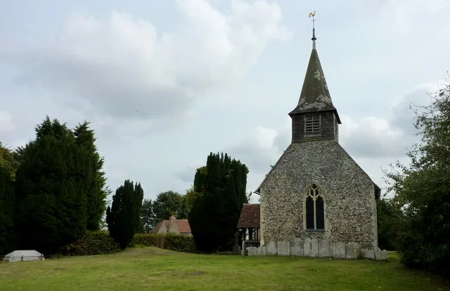 View of the west end of All Saints church, Chillenden Dating from 1180, it was restored by George Gilbert Scott in 1871. He added the shingle spire.
