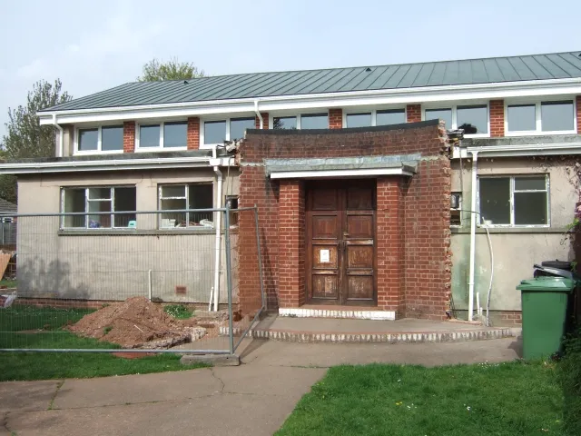 Part of St Lawrence's parish church, Lower Hill Barton Road, Heavitree, Exeter, Devon, seen from the southeast. When this picture was taken, work was in underway to rebuild the entrance with a new porch and disabled access ramp.