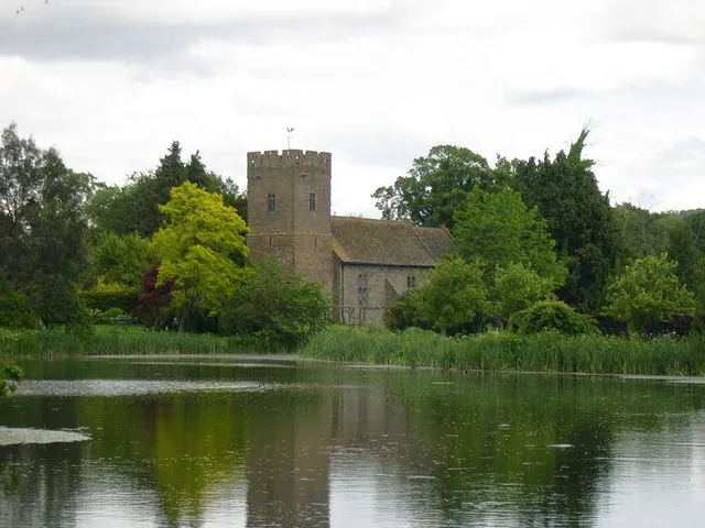 St Mary, Monnington on Wye, near to Monnington on Wye, Herefordshire, Great Britain. The Monnington Court lake in the foreground. Enchanting church, built in 1679, with an earlier tower.