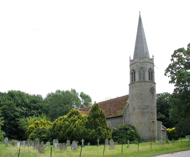 St Andrew's church. St Andrew's church > 1399576 is one of those churches which are surrounded by tall trees and are, for that reason, difficult to photograph. The church stands on an ancient place of worship, bordered by a woodland > 1399549 to the east and by the busy Quidenham Road on the other side. Quidenham Hall, presently a Carmelite Monastery, adjoins in the south > 1399539. The church as we see it today dates from the 14th/15th century but the round Saxon tower is much older, dating from between 950 and 1050. The octagonal top was added in the 15th century and the spire added in 1867 and rebuilt in 1930. St Andrews has eight stained glass windows > 1399590 - 1399596 most dating from the 19th and early 20th centuries and making the interior quite dark. The modern east window of the memorial chapel was designed by Reginald Bell and depicts an American airman meeting Jesus > 1399586. This was the first commemorative window of its kind in England and the chapel is dedicated to the memory of the US airmen of the 96th Bomb Group who were stationed at nearby Snetterton and who lost their lives in WWII.