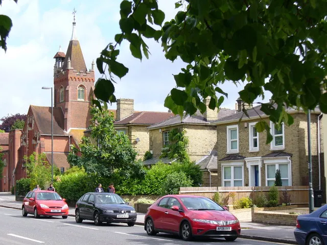 The Avenue, one of the main roads into Southampton, this one carries traffic from Winchester and the north. This is at the Alma Road corner with its distinctive brick spired Avenue St Andrew's United Reformed Church and brick detached houses.