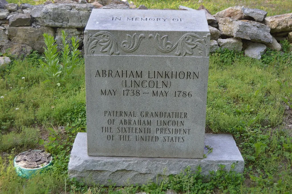 Modern grave marker for Abraham Linkhorn (grandfather of Abraham Lincoln), located in the traditional site of his cabin and death place, the Long Run Baptist Cemetery off Long Run Road in Louisville, Kentucky, United States. The cemetery and associated ruined church are listed on the National Register of Historic Places.