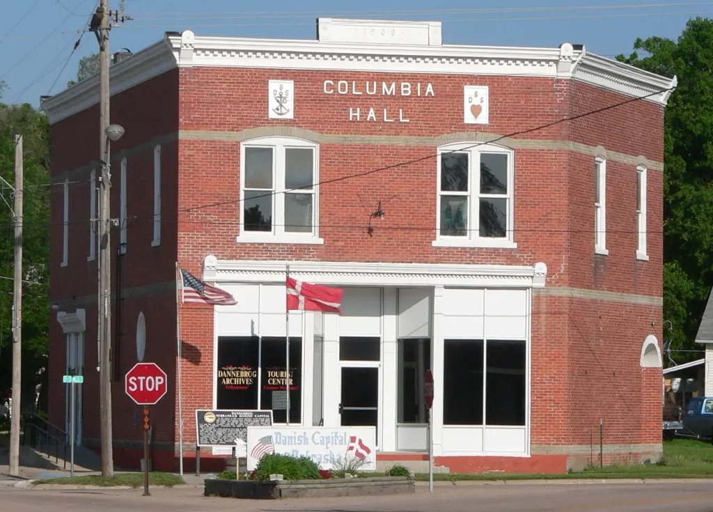 Columbia Hall, at the intersection of Roger Welsch Avenue and Mill Street in Dannebrog, Nebraska; seen from the southeast. The Commercial style building was constructed in 1908. It is listed in the National Register of Historic Places.