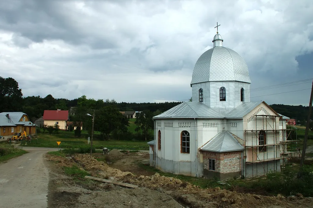 View of the church in Skopów and part of the village itself; Podkarpackie voivodeship, Poland